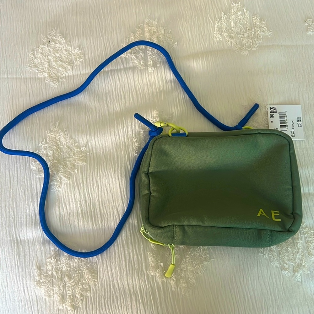 Small green American eagle bag with blue strap